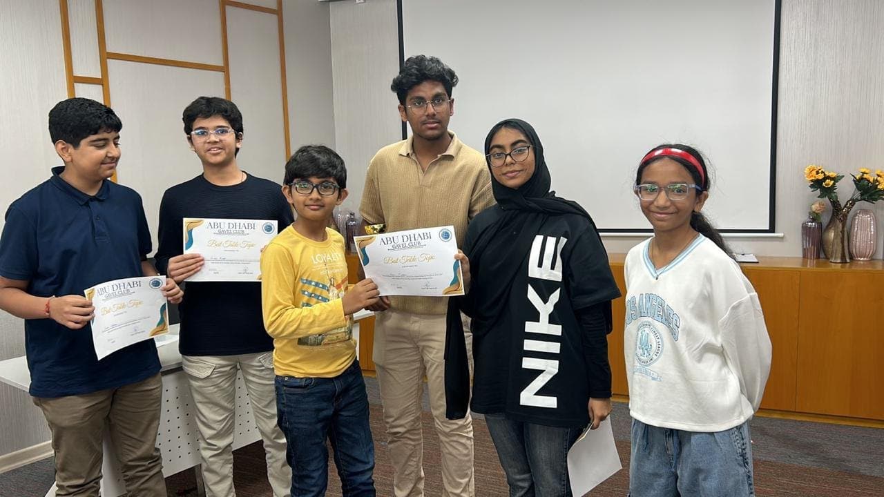 Members holding their Best Table Topic certificates